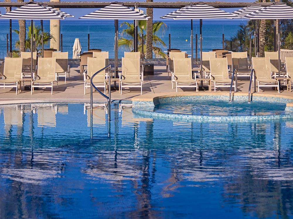 Pool and sunbathing service Pool and sunbathing service universal hotel neptuno adults only